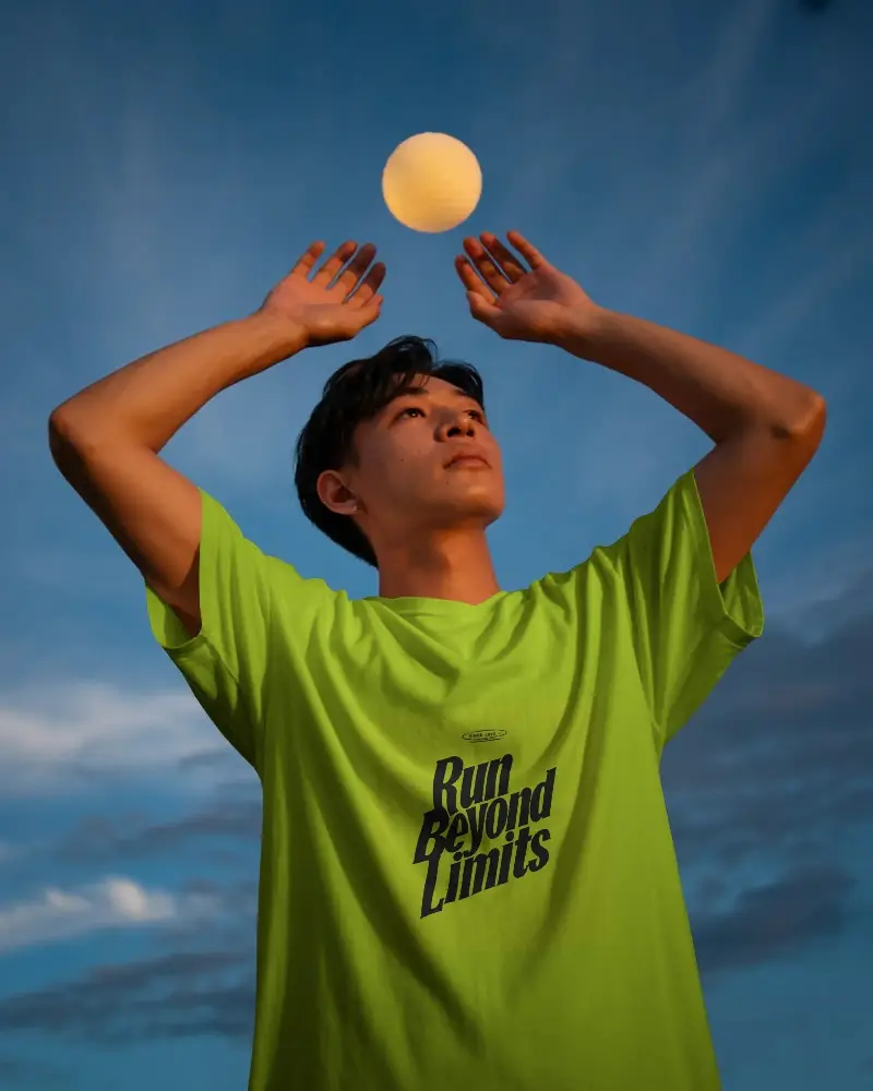 Simple Basic Crewneck Tshirt Mockup For Young Male Model On Cloudy Blue Sky Background
