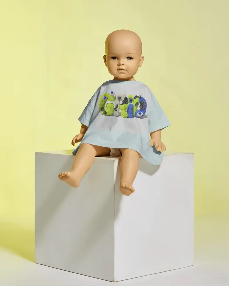 Baby Mannequin T Shirt Mockup Sitting On Cube Minimalist Background Photorealistic Design