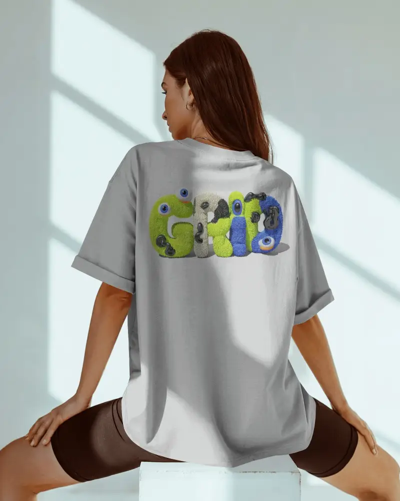 Back View T Shirt Mockup Female Model Seated On Cube Soft Window Light Minimal Studio
