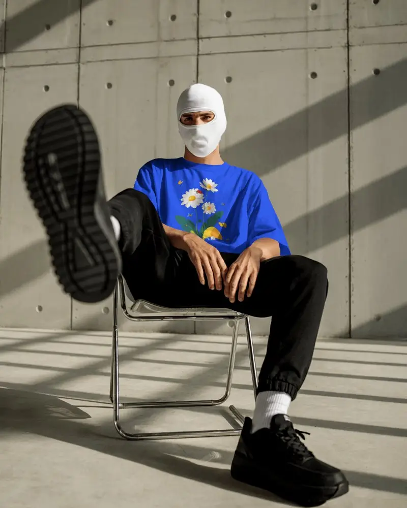 Streetwear T Shirt Mockup Male Model Seated Mask Style Concrete Wall Urban Lighting