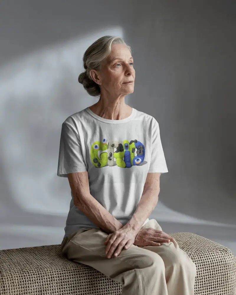 Tshirt Mockup Senior Female Model Seated In Minimal Studio Soft Natural Lighting
