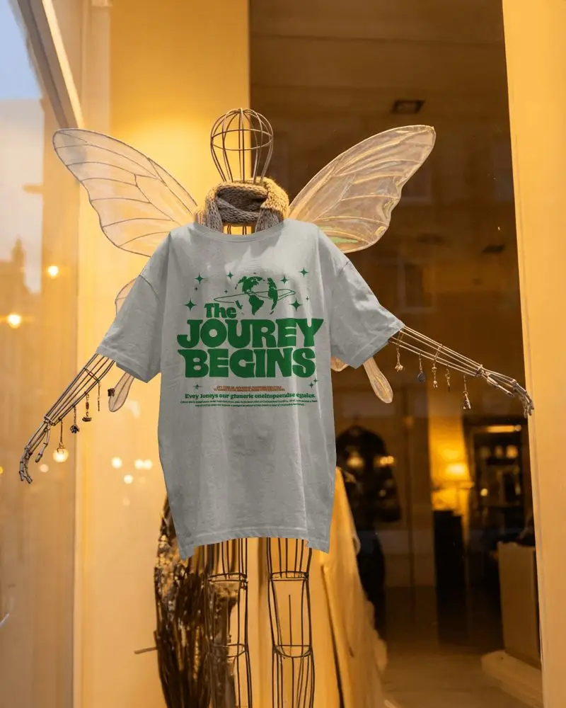 Mannequin Wing Display T Shirt Mockup Hanging On Artistic Wire Figure With Warm Storefront Light