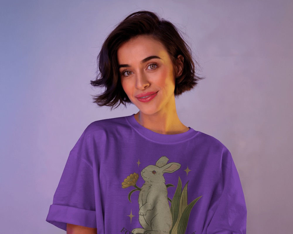 Soft Glow T Shirt Mockup Female Model Smiling In Moody Purple Lighting Cozy And Modern Aesthetic 0670