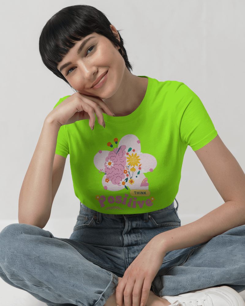 Relaxed Seated T Shirt Mockup Female Model Smiling Gently In Casual Denim Outfit Minimalist Background 0754