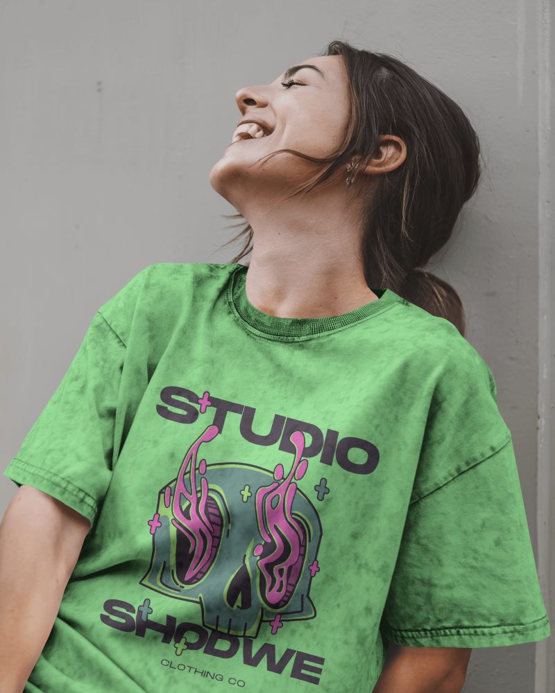 Urban Relaxed Acid Wash T Shirt Mockup Female Model Laughing In Washed Grey Tee Casual And Carefree Vibe 0772