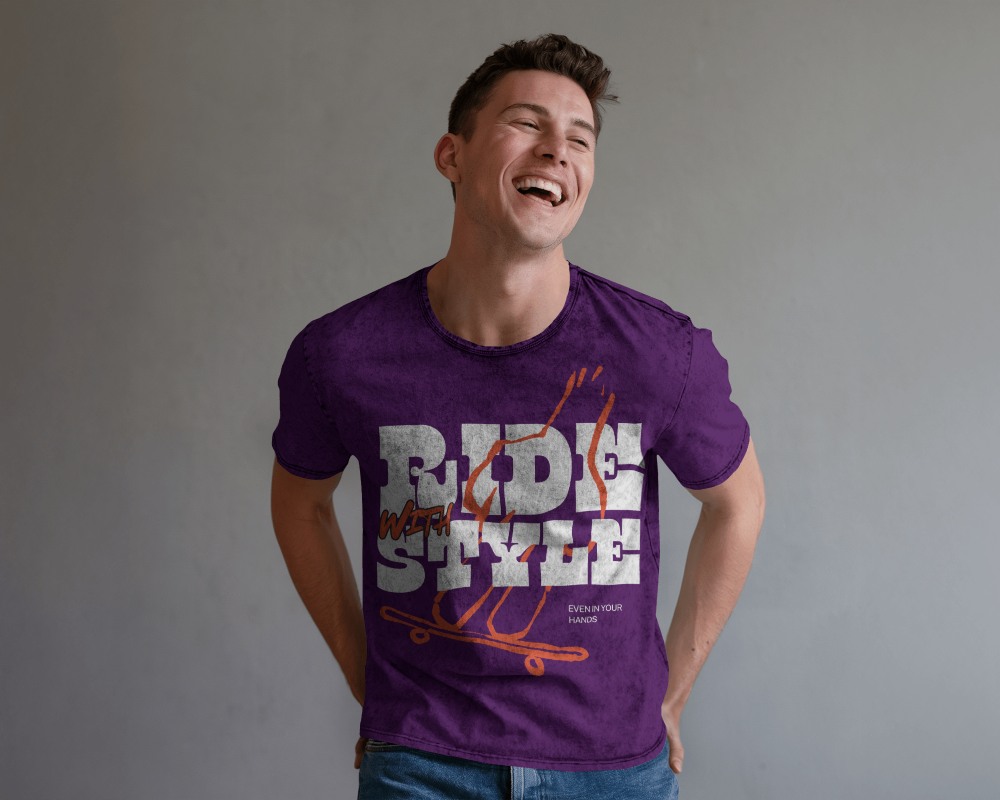 Acid Wash T Shirt Mockup Happy Male Model Laughing Against Neutral Wall Casual And Relaxed Indoor Setting 0798