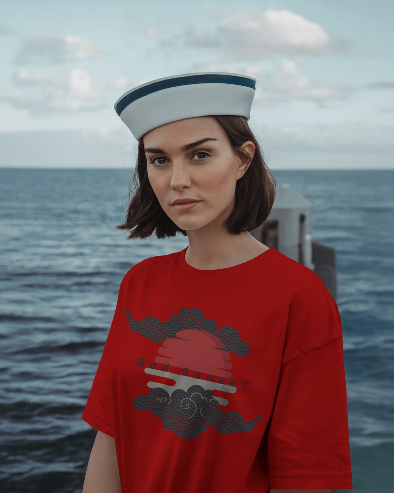 Nautical Themed Blank Women Oversized Round Neck T Shirt Mockup Female Model In Sailor Hat Standing By The Sea Maritime Aesthetic 0821