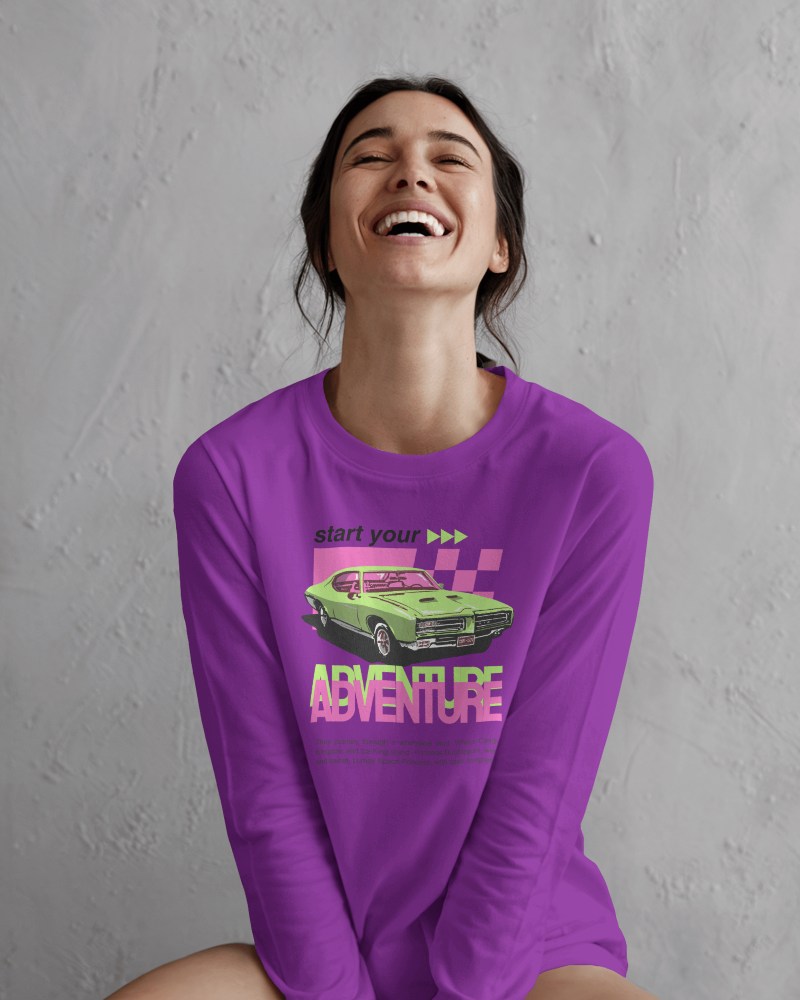 Joyful Studio Blank Round Neck Long Sleeve T Shirt Mockup Woman In White Tee Laughing Against Textured Gray Background 0831