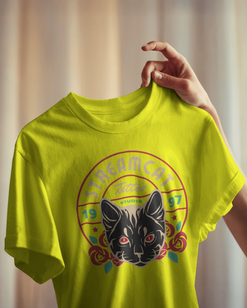 Warm Lit Blank Round Neck T Shirt Mockup Hand Holding White Tee Soft Draping Fabric Cozy Ambient Light 0837