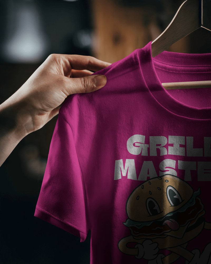 Moody Close Up T Shirt Mockup Hand Holding Round Neck Tee On Wooden Hanger Dramatic Lighting Cozy And Authentic Aesthetic 0840