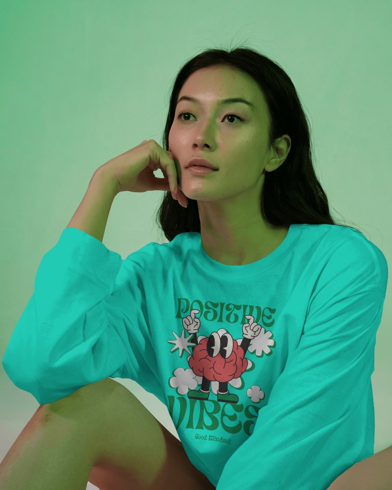Artistic Studio Long Sleeve T Shirt Mockup Female Model In Thoughtful Pose Under Green Mood Lighting Modern And Expressive Aesthetic 0865