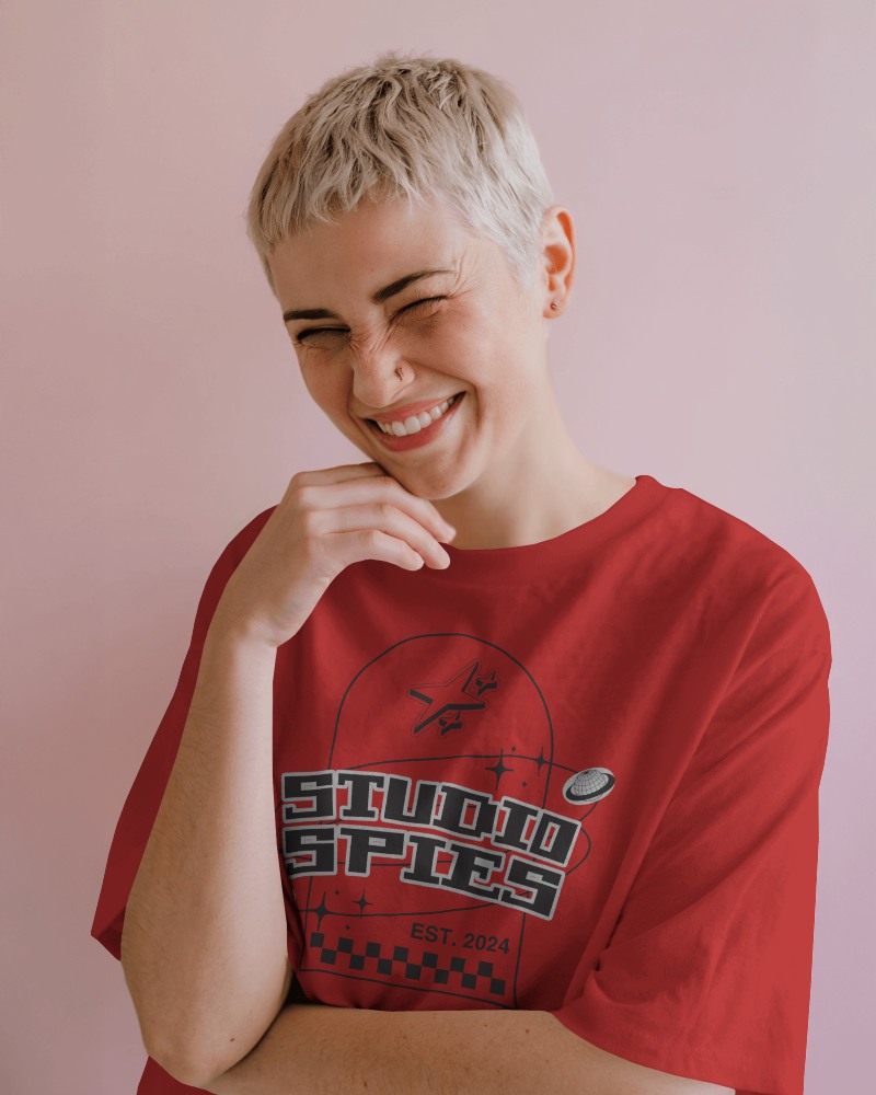 Playful Tshirt Mockup Smiling Female Model With Short Hair In Relaxed Pose Against Soft Pink Background Lighthearted And Modern Style 0910