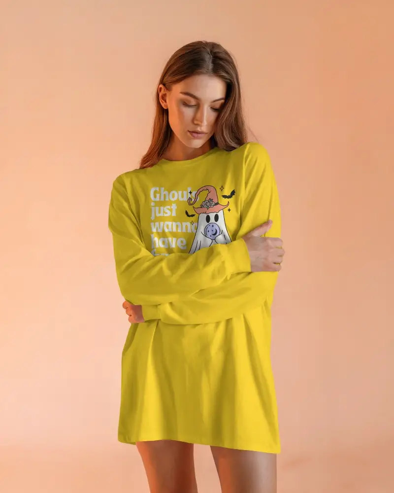 Minimalist Studio Long Sleeve Tshirt Mockup Female Model In Relaxed Pose Soft Peach Background Clean And Elegant Look