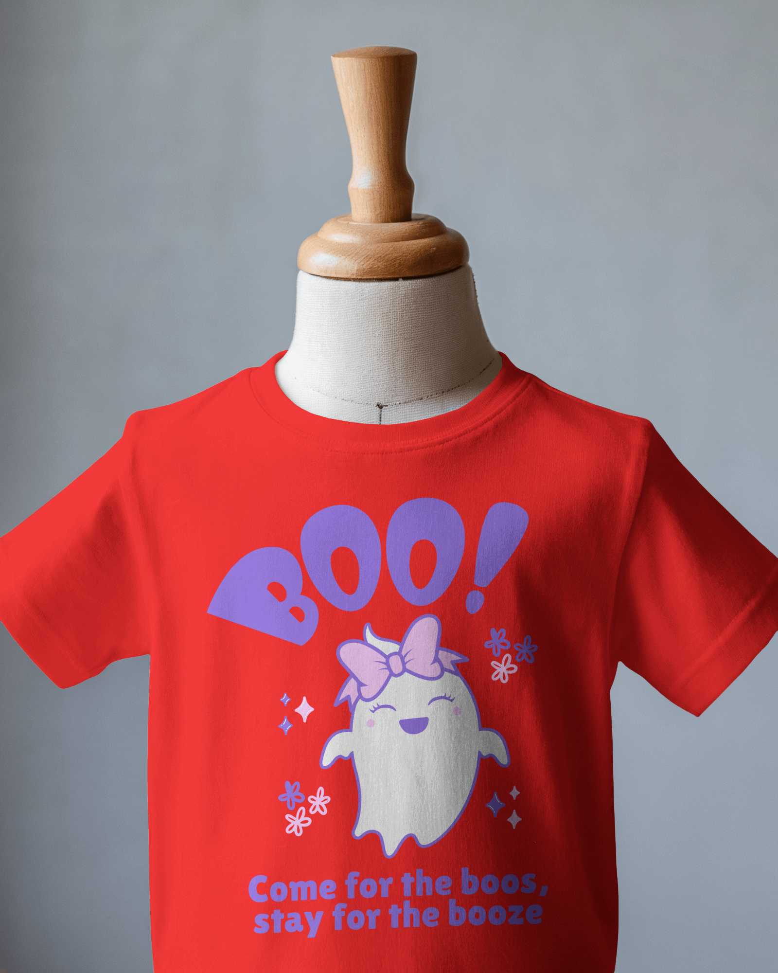 Minimalist Kid T Shirt Mockup On Wooden Mannequin Against Soft Gray Background Simple And Elegant Presentation