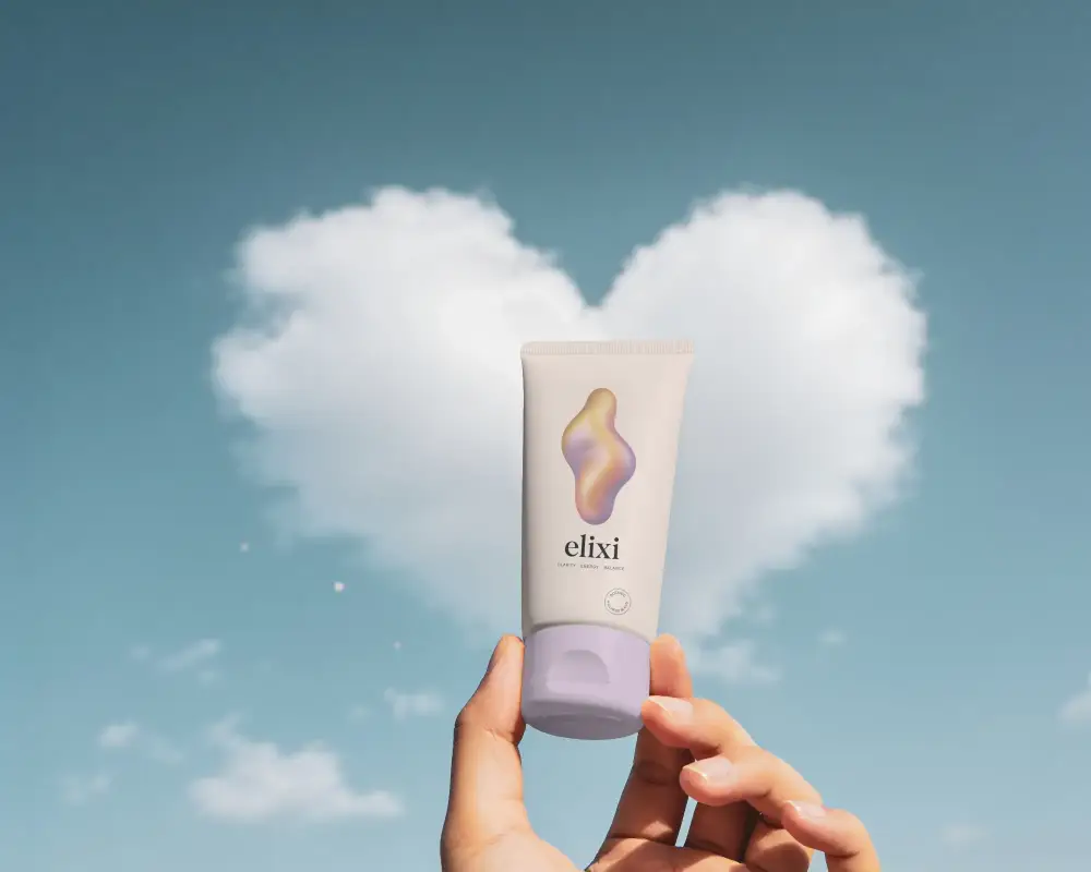 Skincare Tube Mockup With Clear Sky And Heart Shaped Cloud Ideal For Brand Promotion