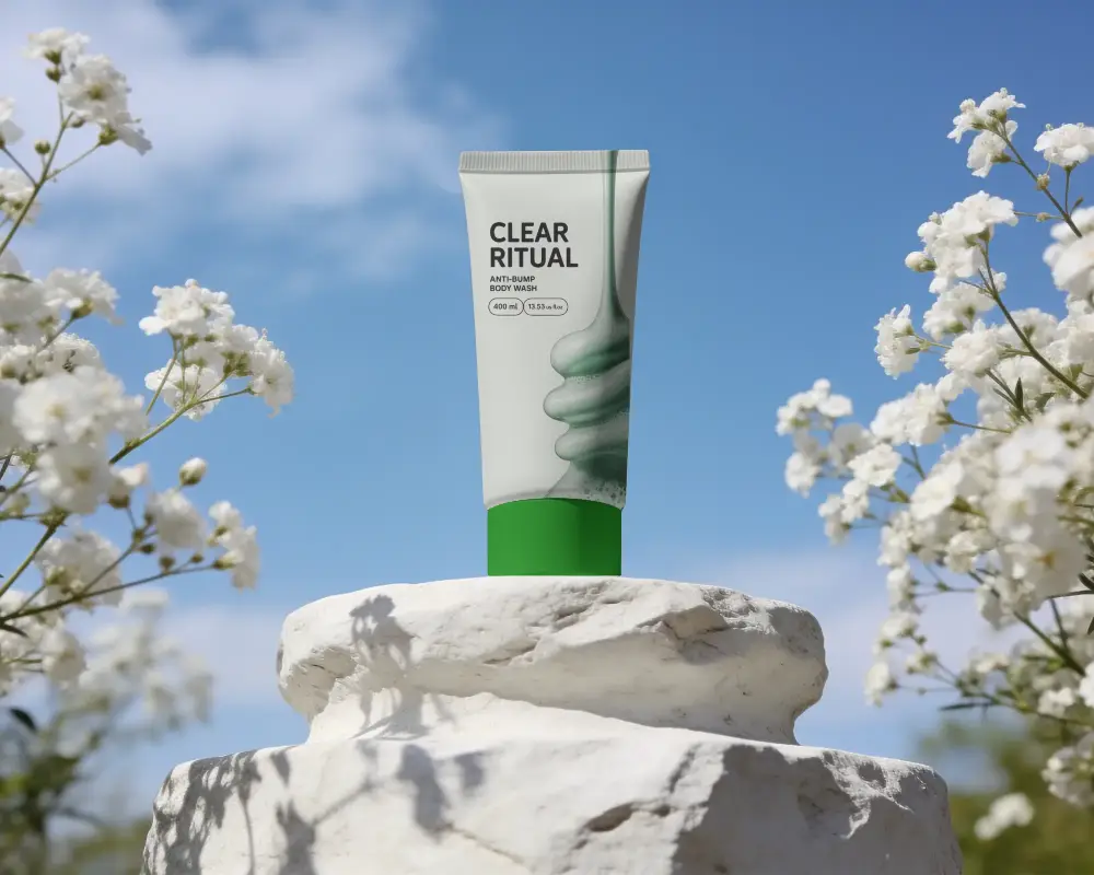 Natural Skin Care Tube Mockup On Stone Pedestal With Floral Background For Branding
