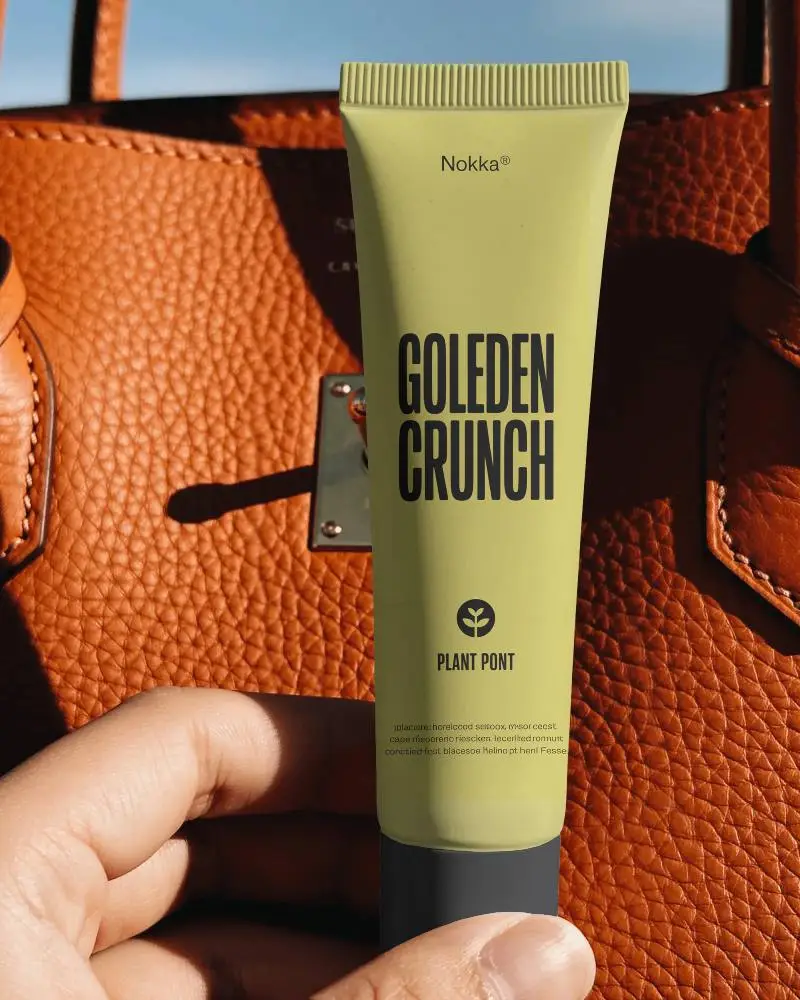 Hand Holding Plain Squeezable Tube Mockup With Close Up Textured Background