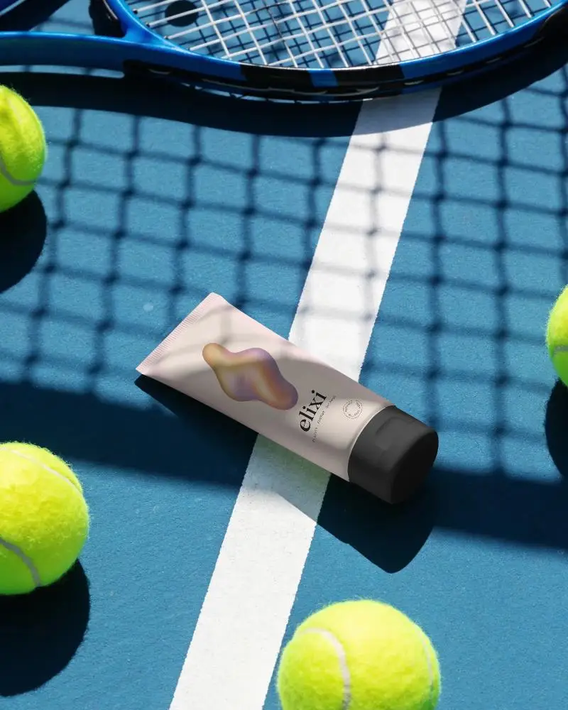 Sports Cream Tube Mockup With Tennis Balls And Racket On Court Background