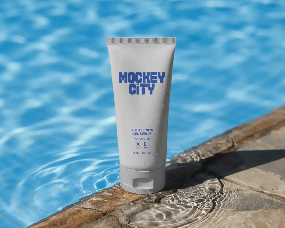 Cosmetic Squeeze Tube Mockup Near Waterfront Showcasing Daily Personal Care Product