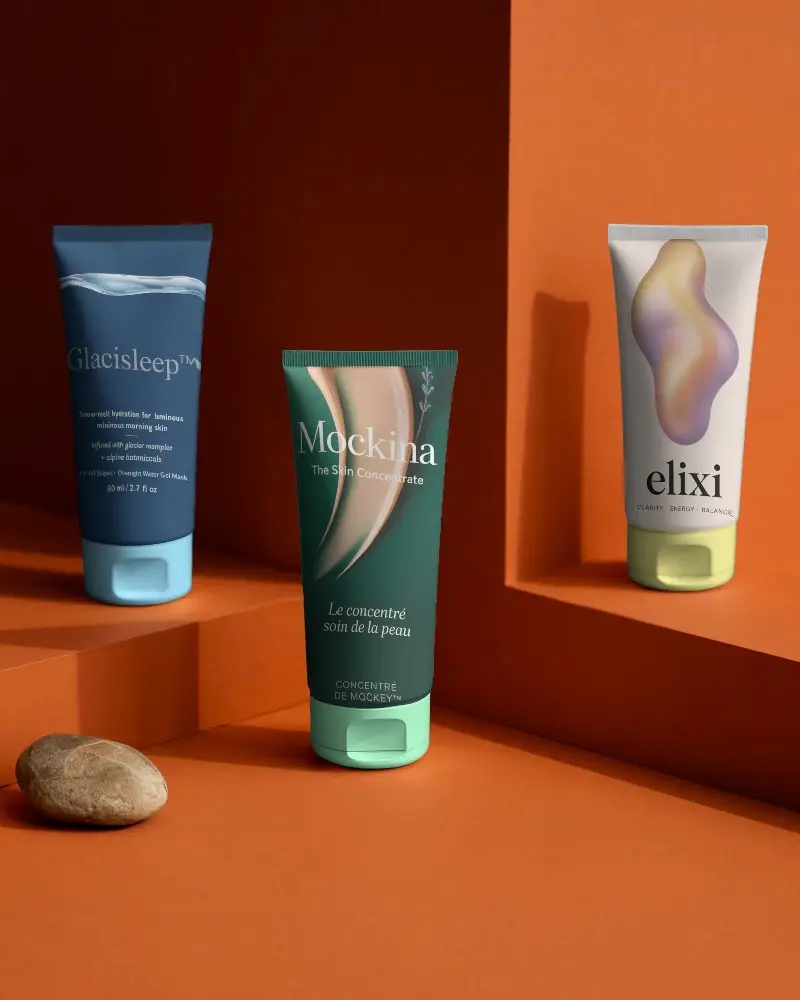 Sleek Skincare Tube Mockup Placed On Geometric Platform With Natural Stone Accessory Display