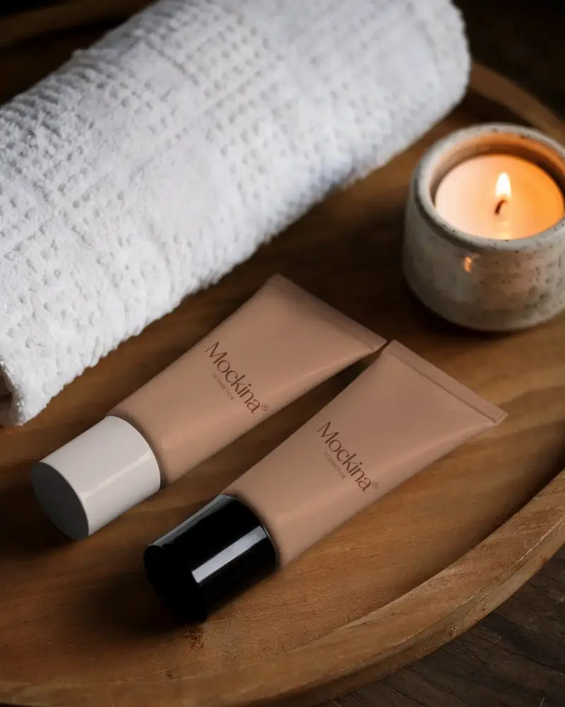 Natural Skincare Tube Mockup With Soothing Candle And Soft White Towel On Wooden Tray