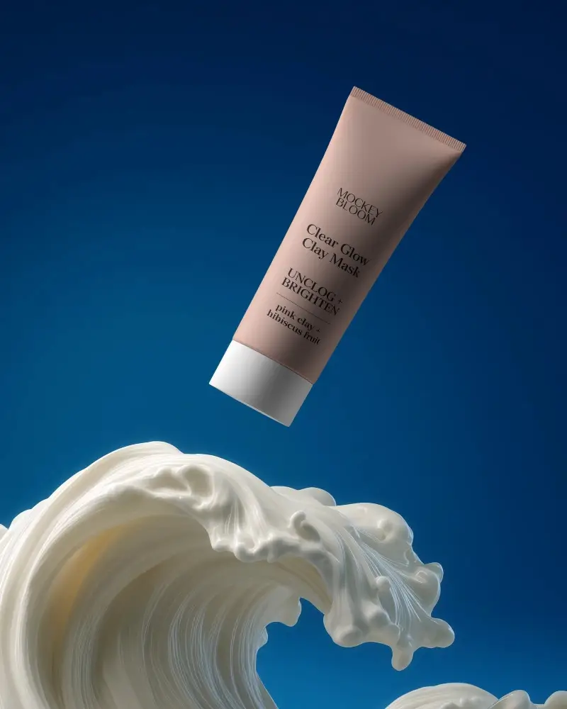 Premium Cosmetic Tube Mockup With Creamy Texture Floating Over Blue Background