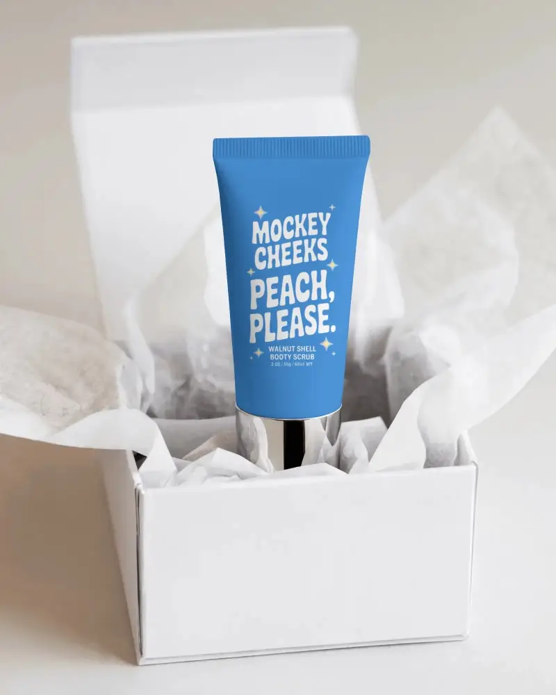 Minimalistic Packaging Design Showcasing Tube Inside Clean White Gift Box