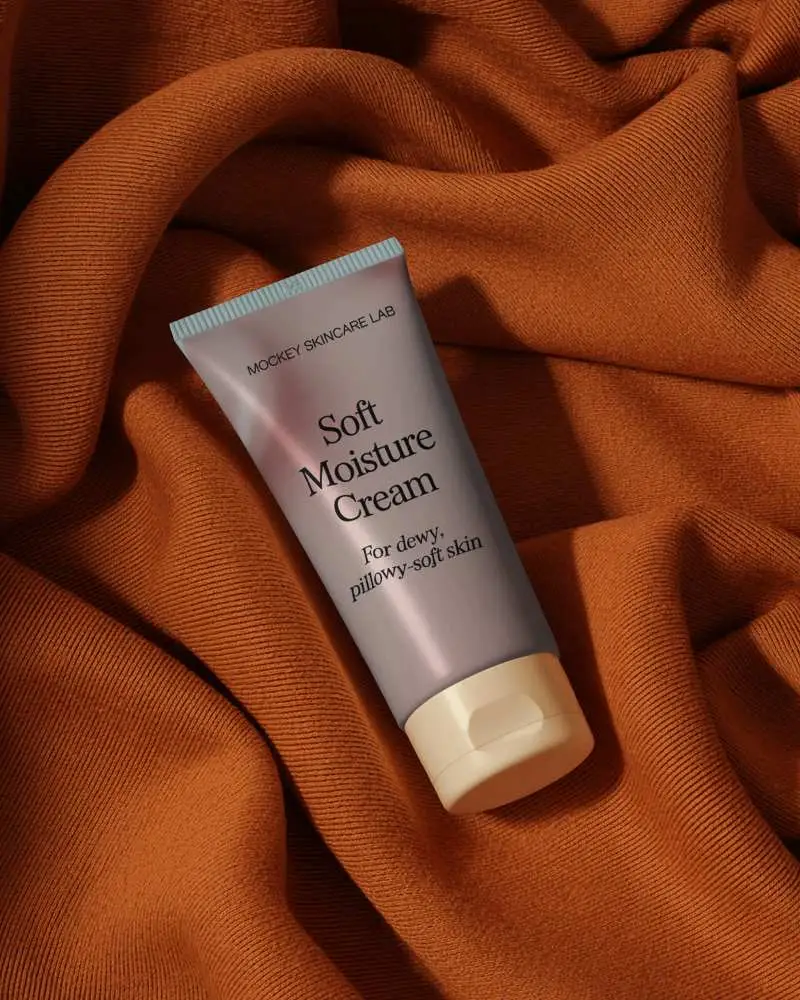 High Resolution Tube Mockup On Textured Fabric Background For Brand Presentation