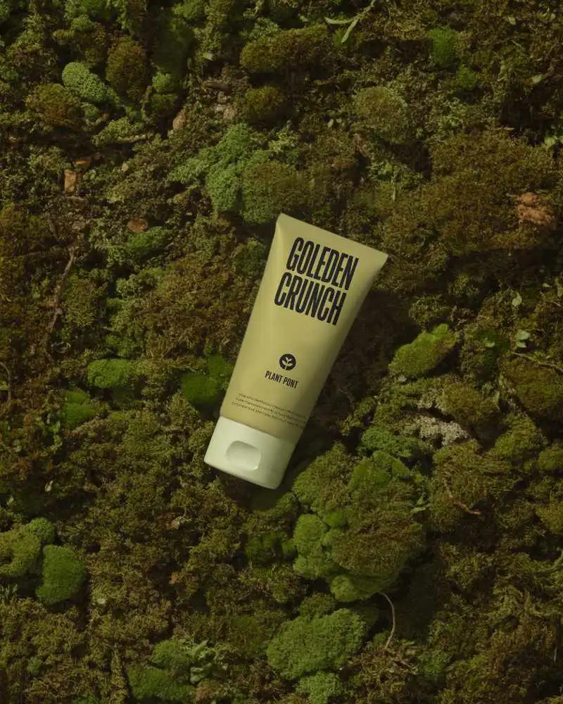 Beauty Product Tube Mockup Against Forest Floor Moss Textured Backdrop For Presentation