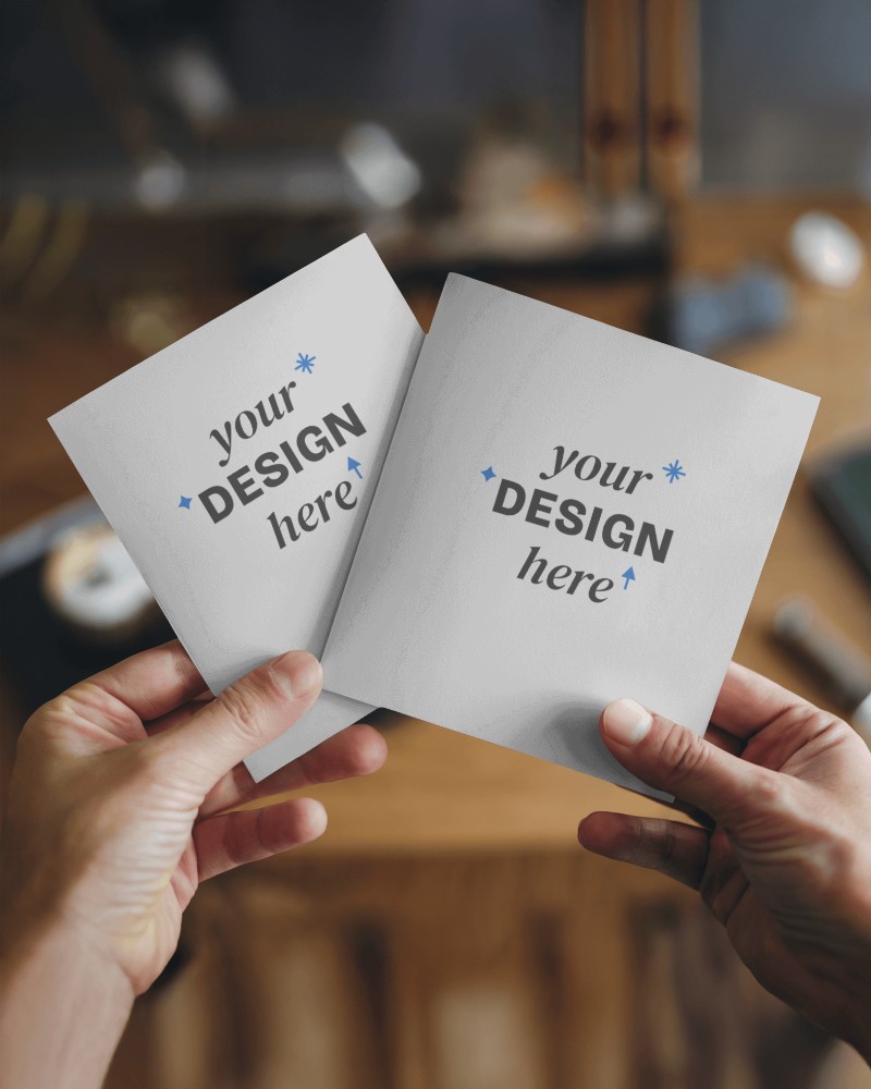 Hands Presenting Brochure Mockup Over Blur Background