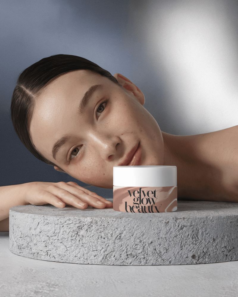 Soft Toned Cosmetic Mockup Glowing Female Model With Moisturizing Cream On Textured Pedestal