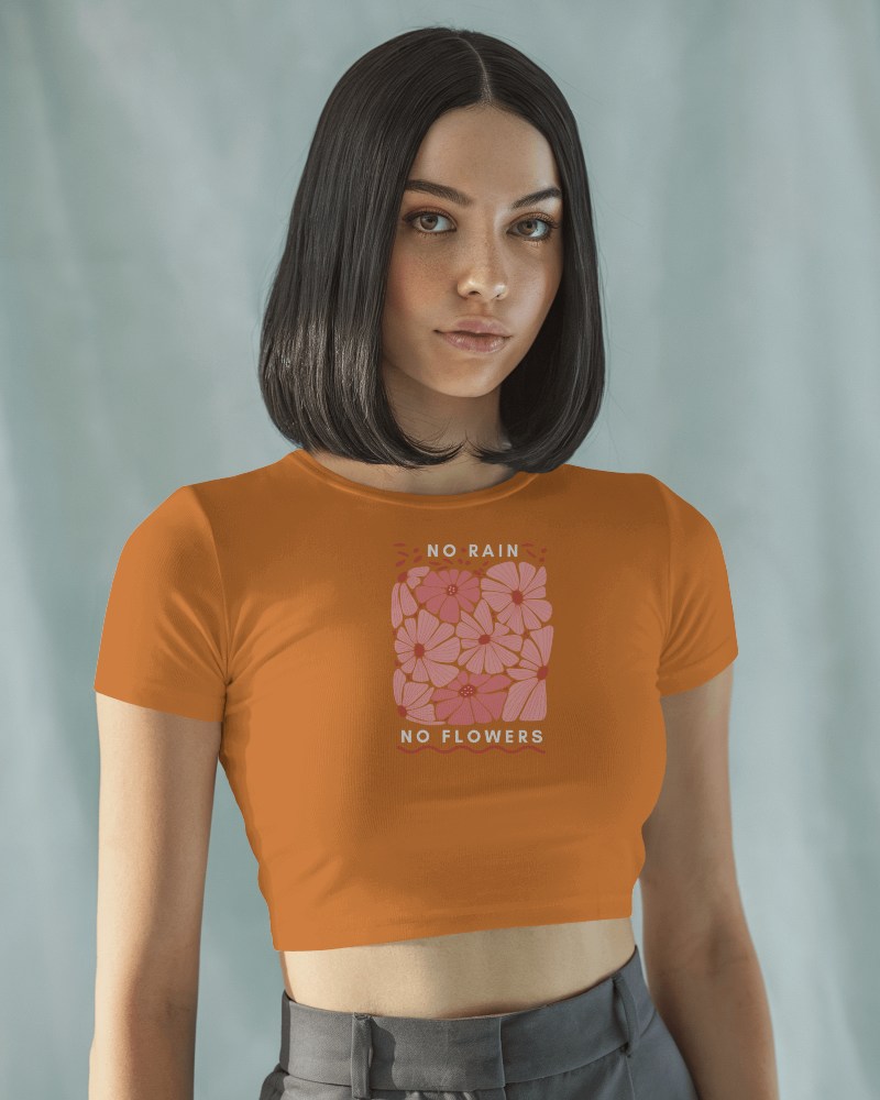 Rust Orange Crop Top Mockup Female Model In Floral Graphic Tee With Inspirational No Rain No Flowers Text Soft Lighting 035