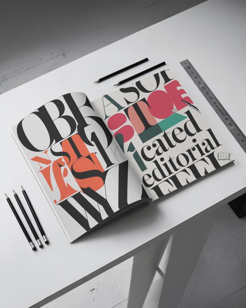 Typography Focused Magazine Mockup Open Layout With Abstract Lettering On Desk