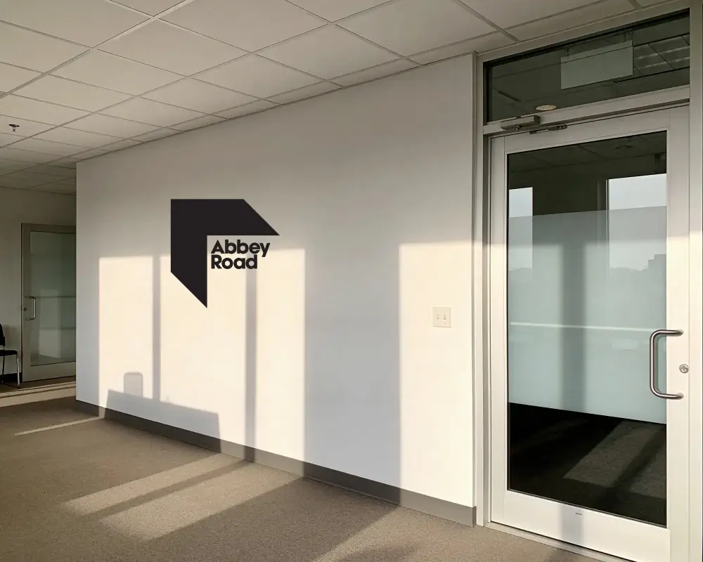Empty Office Space With Modern Glass Door And Minimalist Wall For Logo Mockup