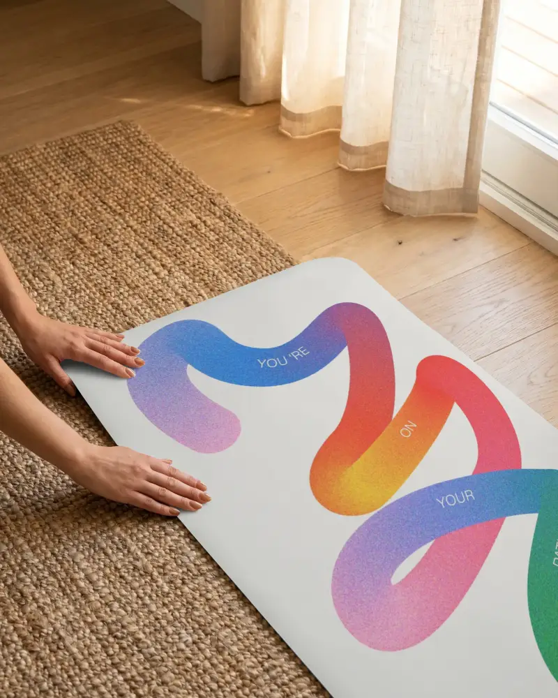 Eco Friendly Non Slip Yoga Mat Mockup Folded On Natural Textured Woven Jute Rug Floor