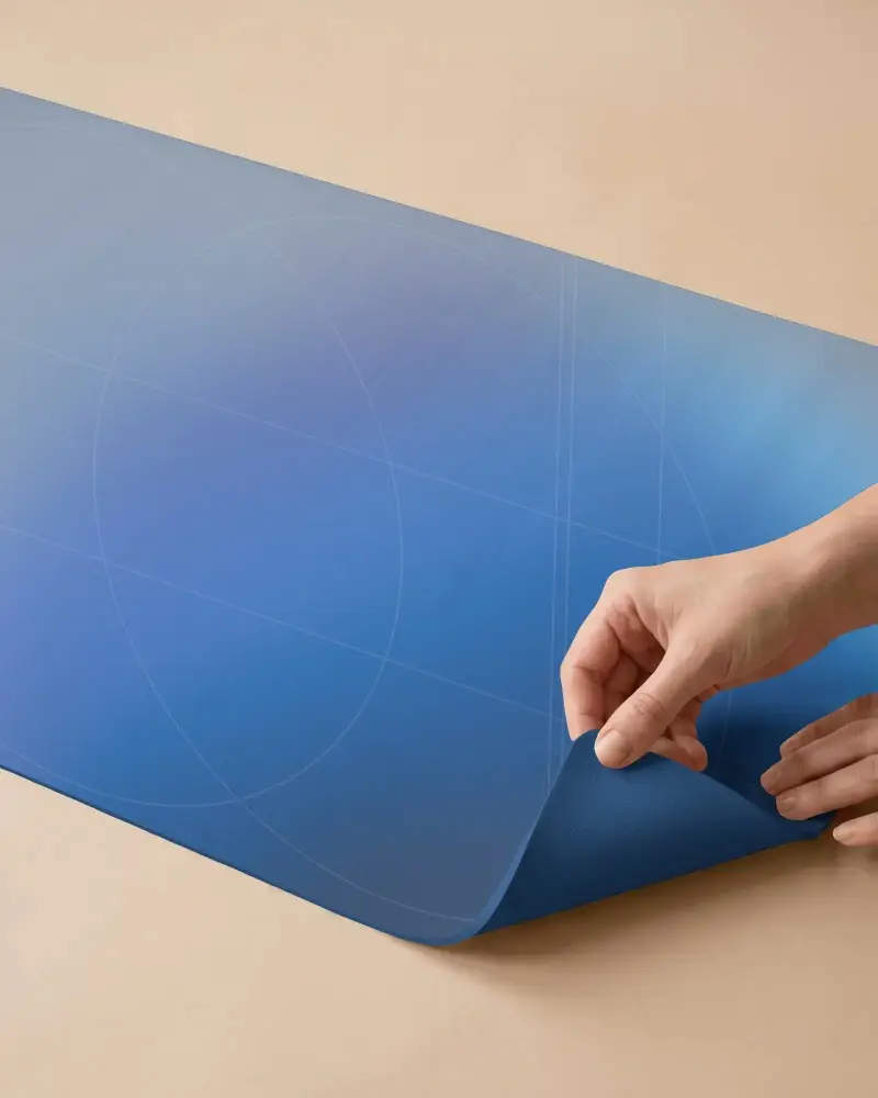 Close Up Yoga Mat Mockup With Hand Lifting Corner On Warm Beige Background And Textured Surface
