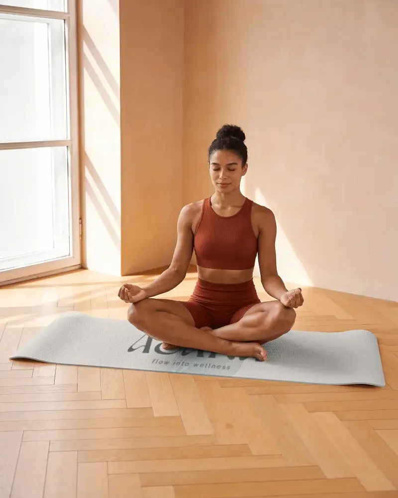 Woman Meditating On Textured Yoga Mat Indoor Peaceful Mindfulness Practice