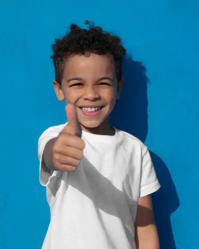 Baby Tee Mockup Happy Child Wearing Tshirt Giving Thumbs Up Against Bright Blue Wall