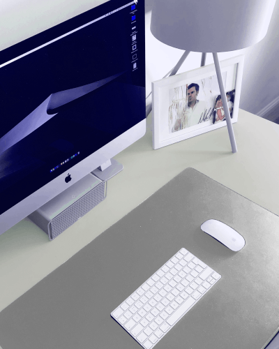 Large Gaming Pad Below Keyboard And Mouse With Photo Frame In Background