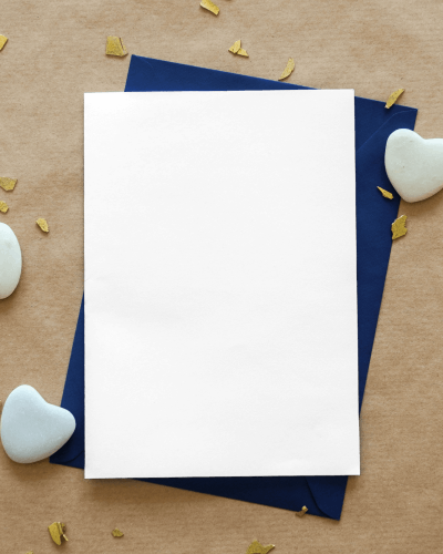 greeting-card-on-sand-paper-with-heart-shaped-stones-lying-beside-14