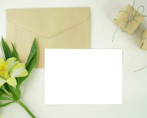 landscape-greeting-card-on-envelope-beside-flower-and-gift-boxes-05