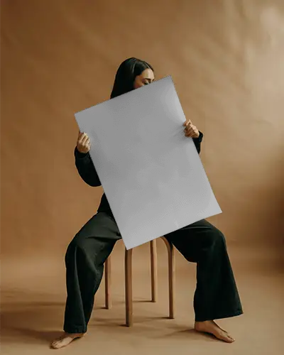 Seated Person Presenting Empty Poster Mockup Design Display Minimalist Setting