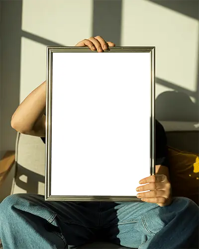 Modern Poster Mockup With White Space Held By Sitting Person For Advertising