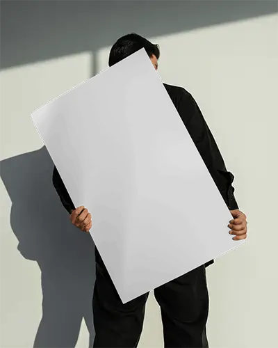 Man Holding Large Poster Mockup For Creative Marketing Project Presentation