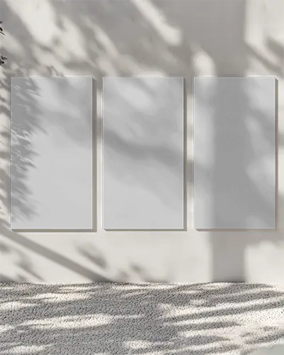 Three Set Vertical Poster Mockups On Textured Wall With Natural Light Shadow Play