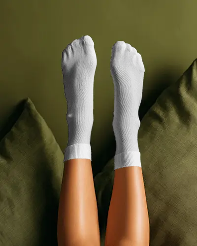 Crew Socks Mockup Top View Feet Raised Relaxed Lifestyle Bedscene Product Shot Natural Light