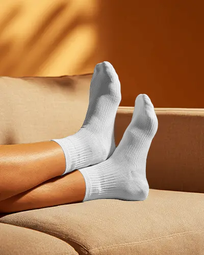 Lifestyle Crew Socks Mockup Feet Extended Comfortable Indoor Setting Lifestyle Shot