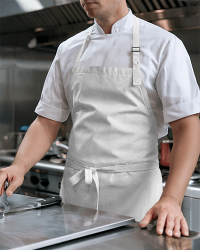 Culinary Artist Green Apron Mockup Male Model With Kitchen Tools On Counter