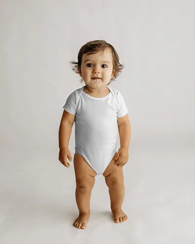 Smiling Toddler Baby Onesie Mockup Front View Standing On Clean Studio Floor Natural Light