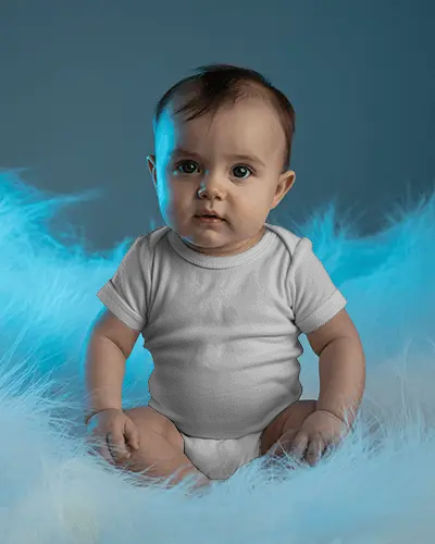 Dreamy Studio Baby Onesie Mockup Seated Infant Soft Feather Texture Cool Blue Lighting